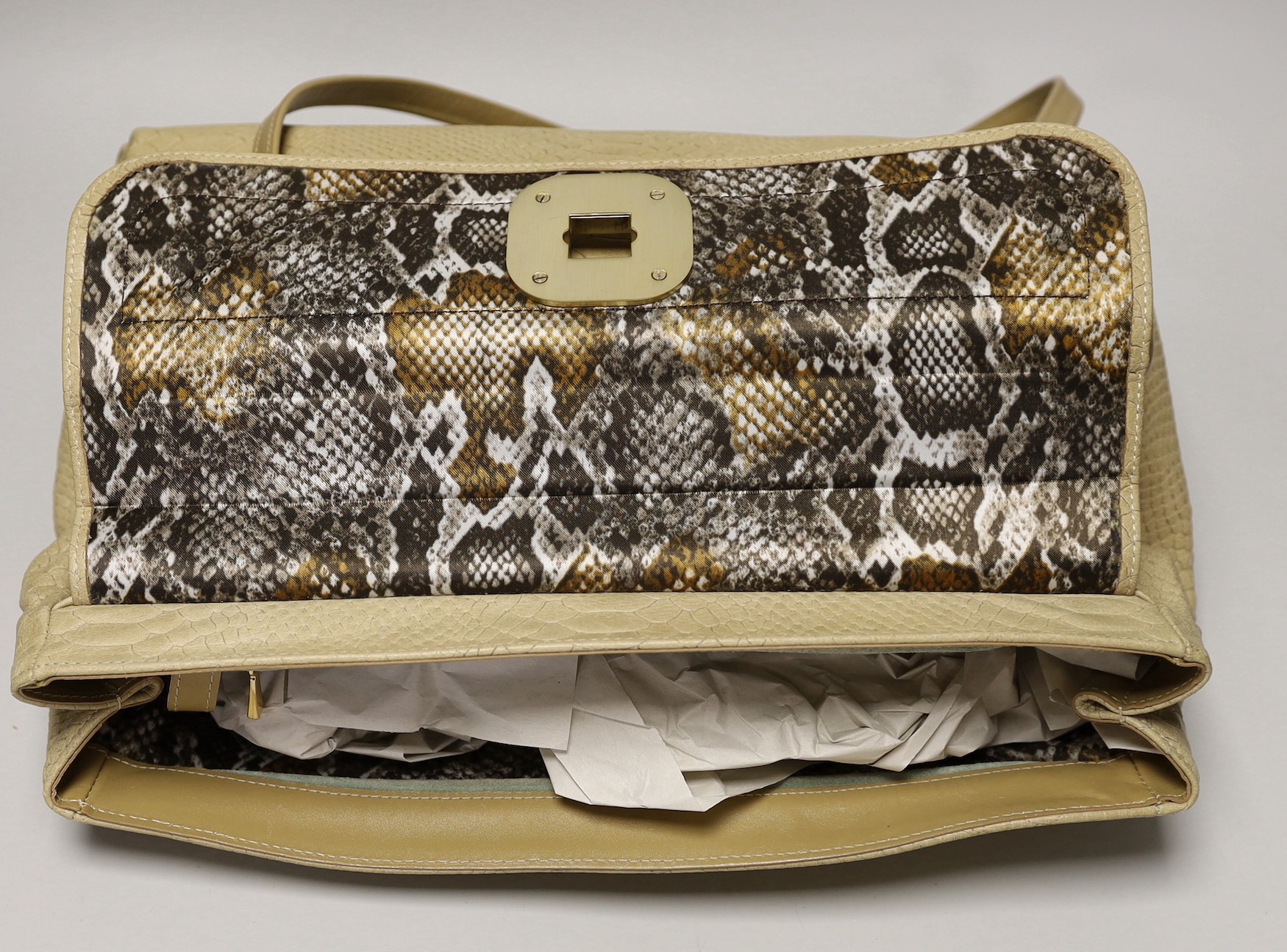 A buffalo tan leather Longchamp Women’s bag, together with a white leather Salvatore Ferragamo Women's shoulder bag. Both with original dust bags